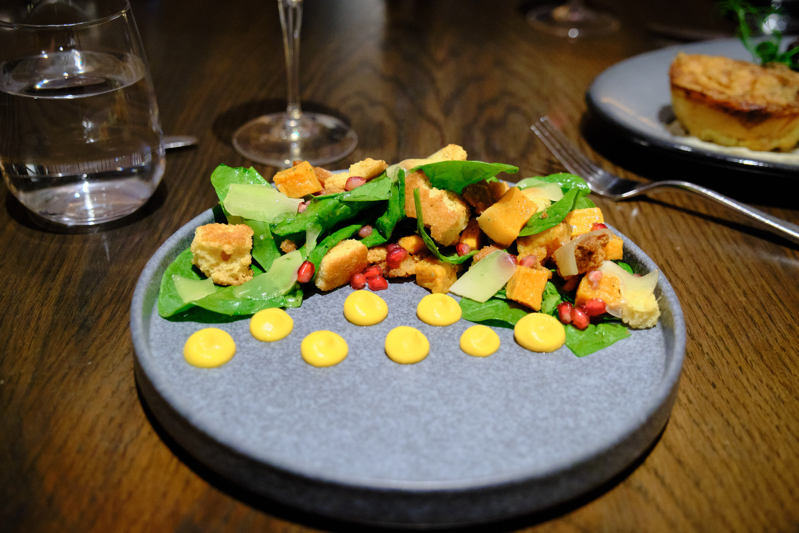 Vegetables and sauce dots, deliberate composition.