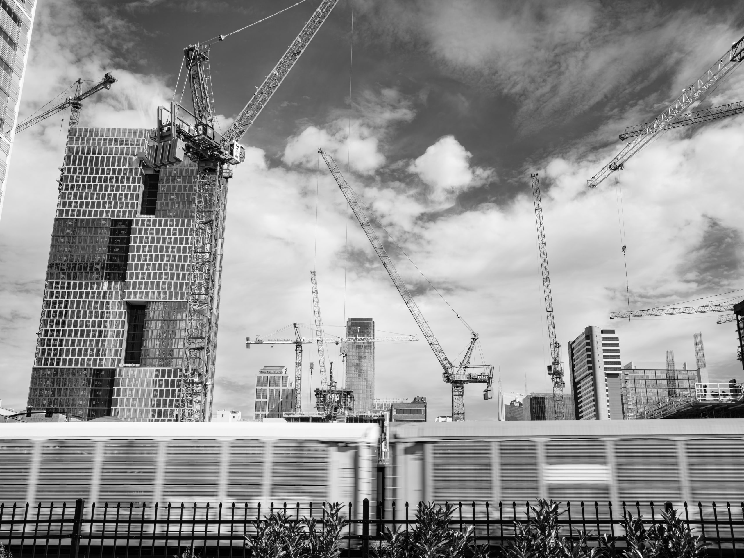 B&w site, crane and cloud.