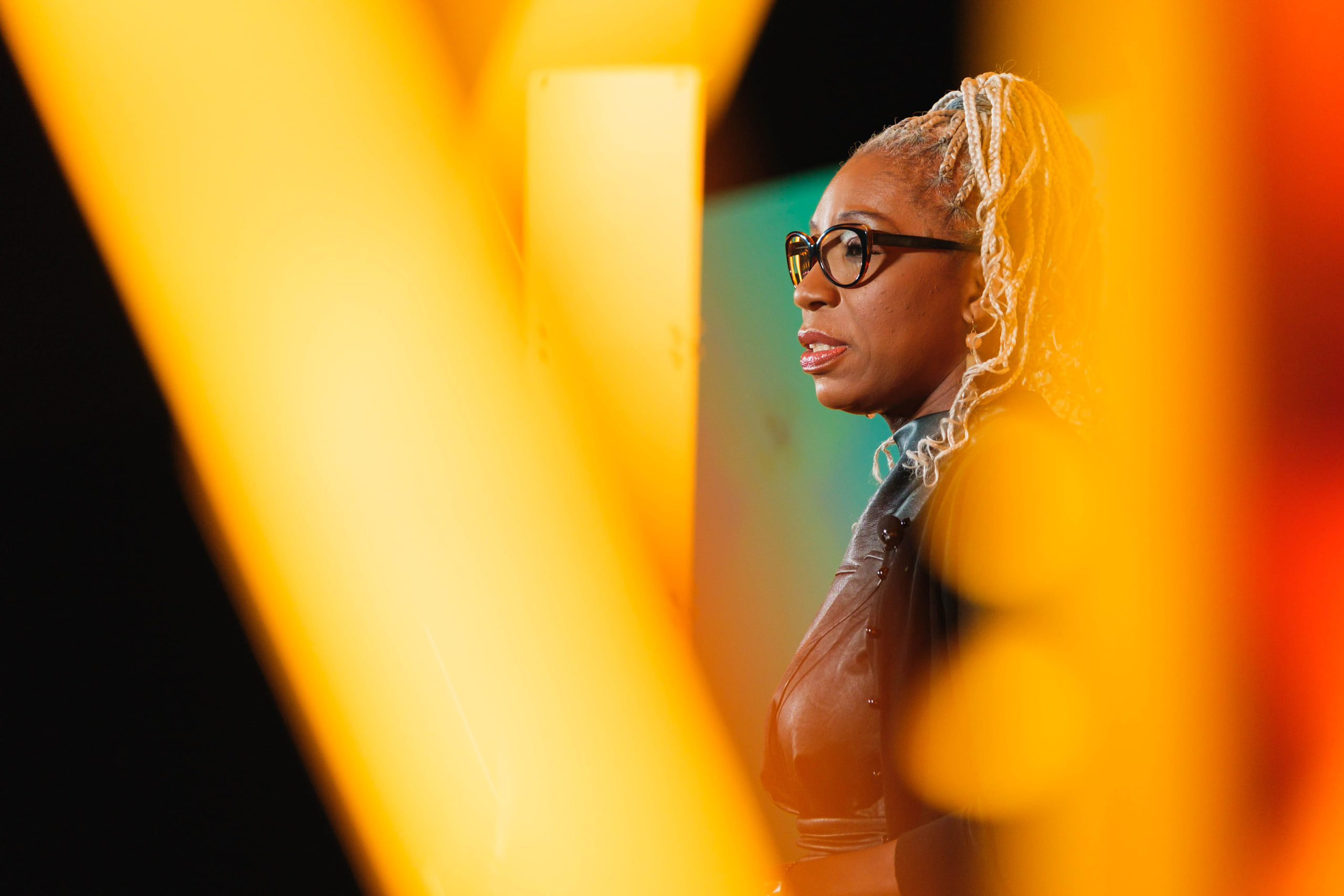 Profile through gold at a national summit afternoon plenary.