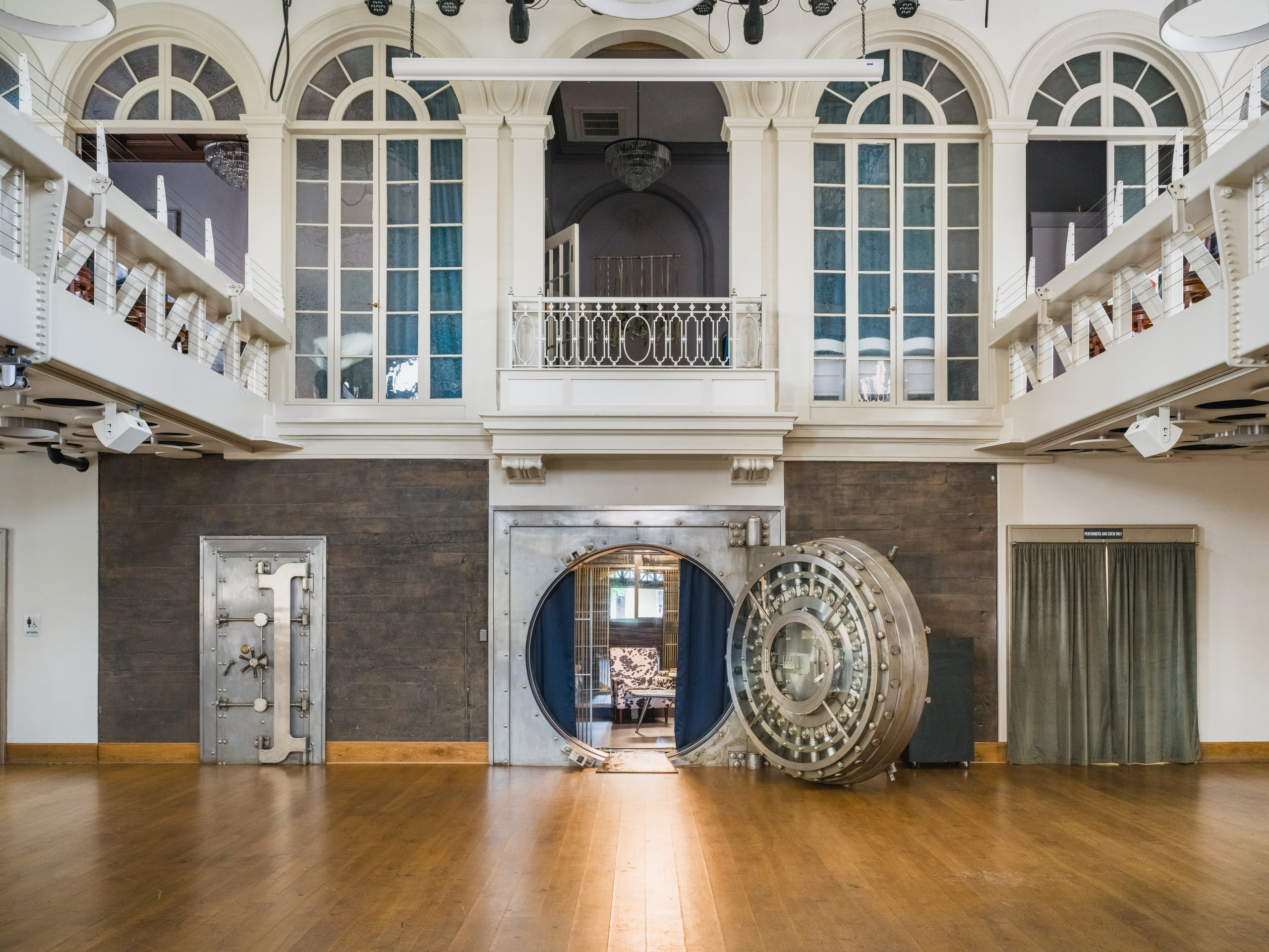 The main hall at The Exchange on Loudoun with the open vault door and the mezzanine, empty.