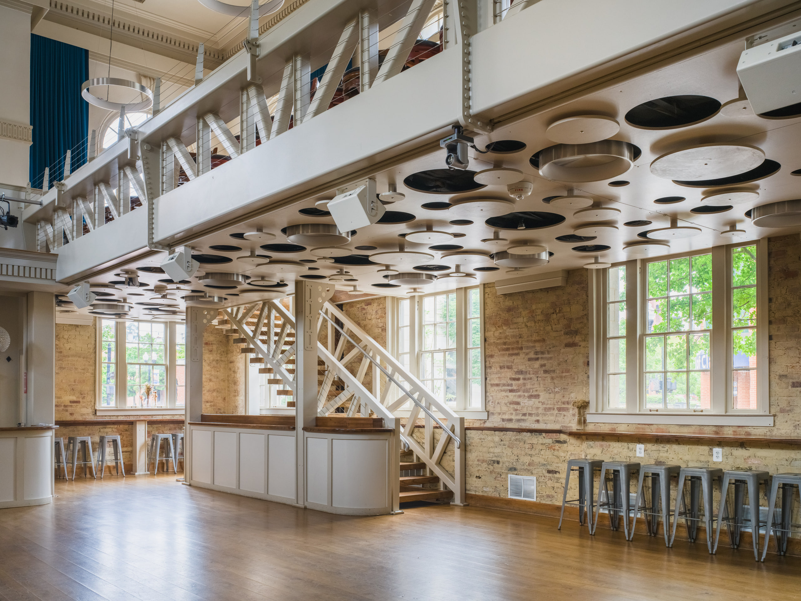Hall wide, ceiling pattern carries the frame.