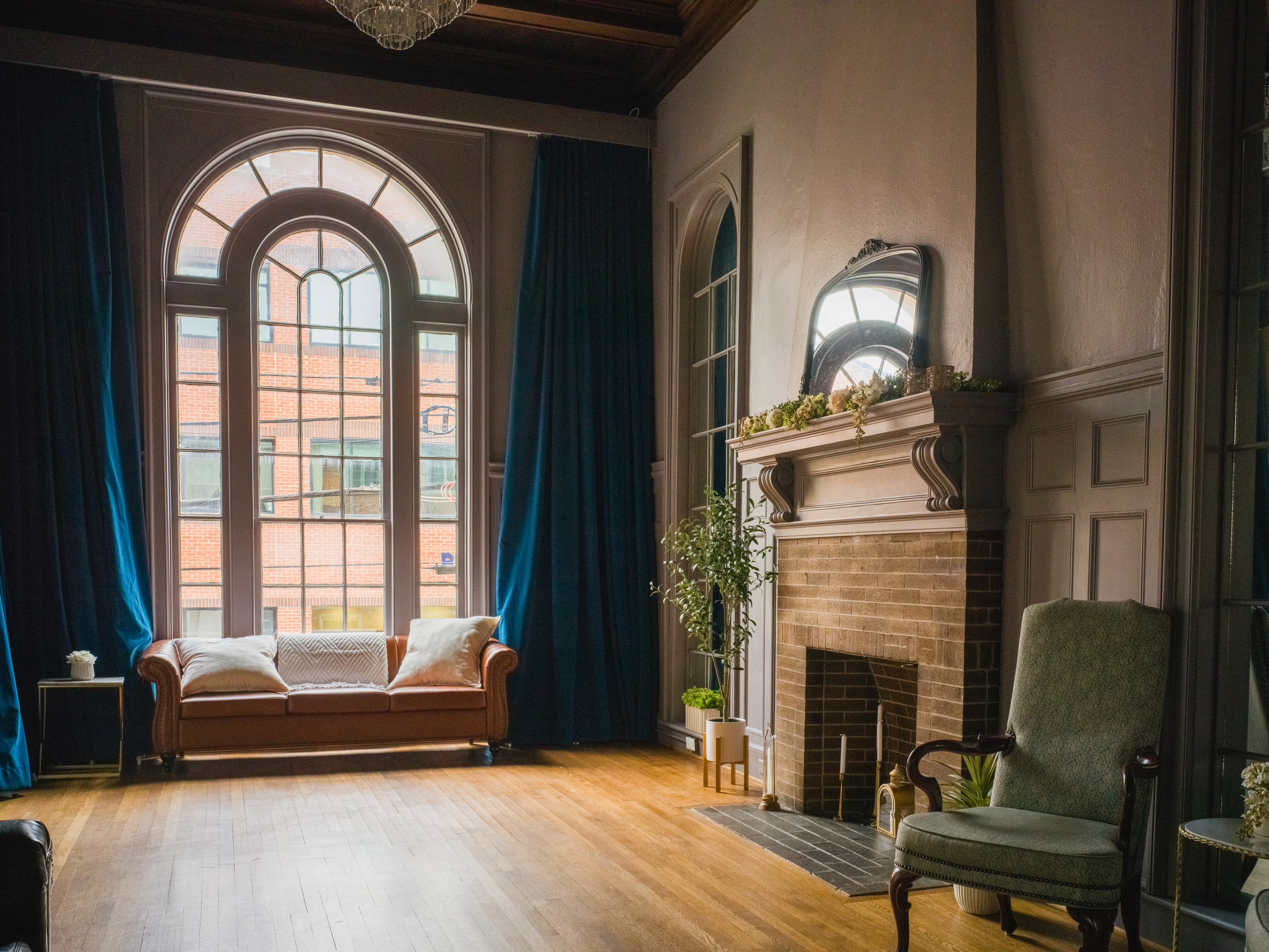 Arched window, drape, light.