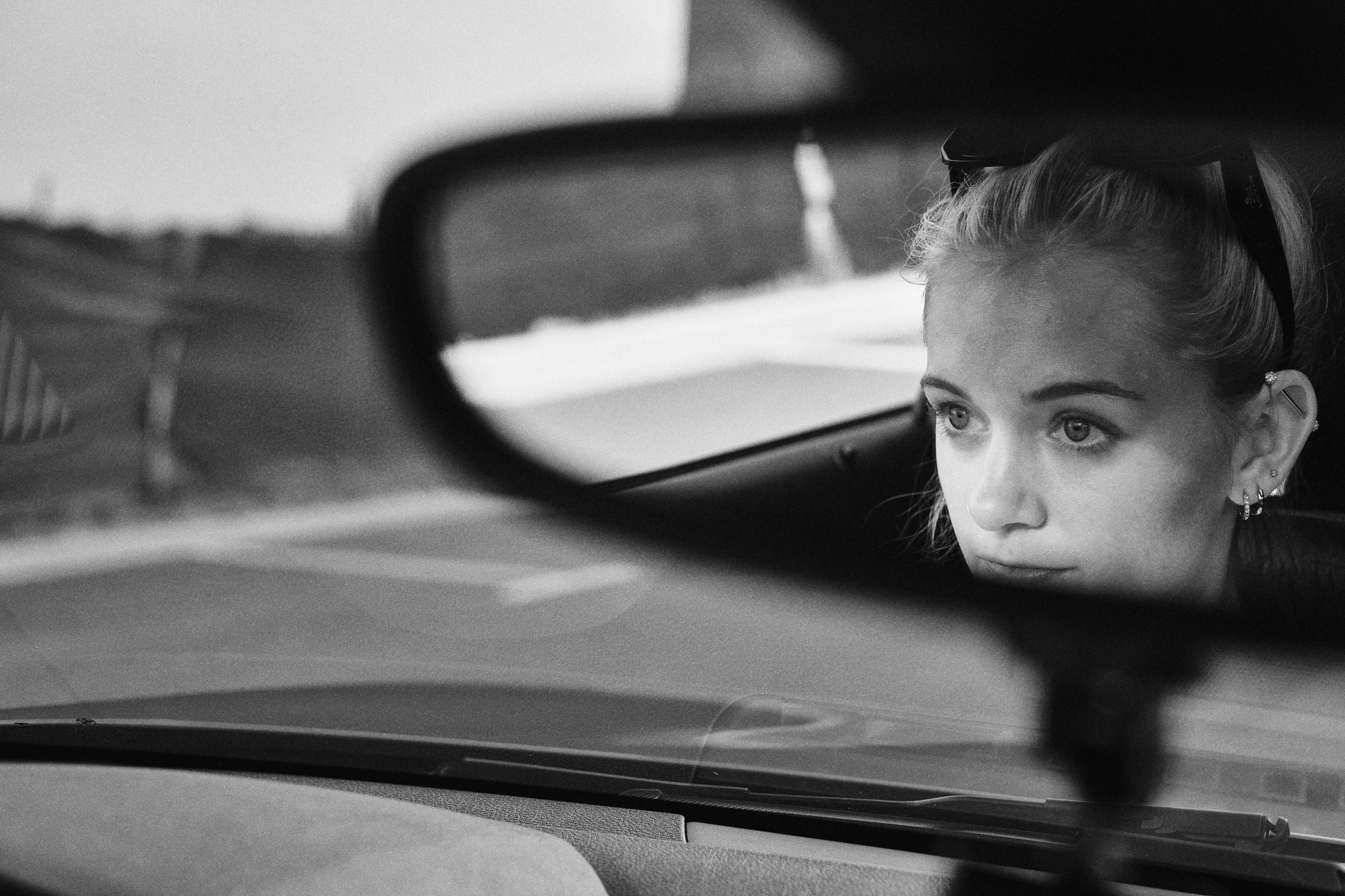 Black and white face in the mirror, close.
