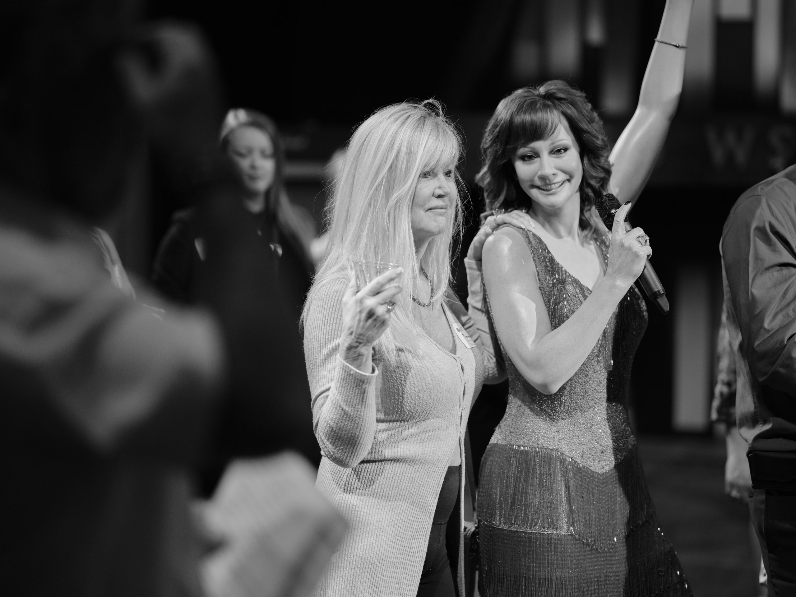 Black and white two women dancing at an industry mixer at a music venue, Nashville.