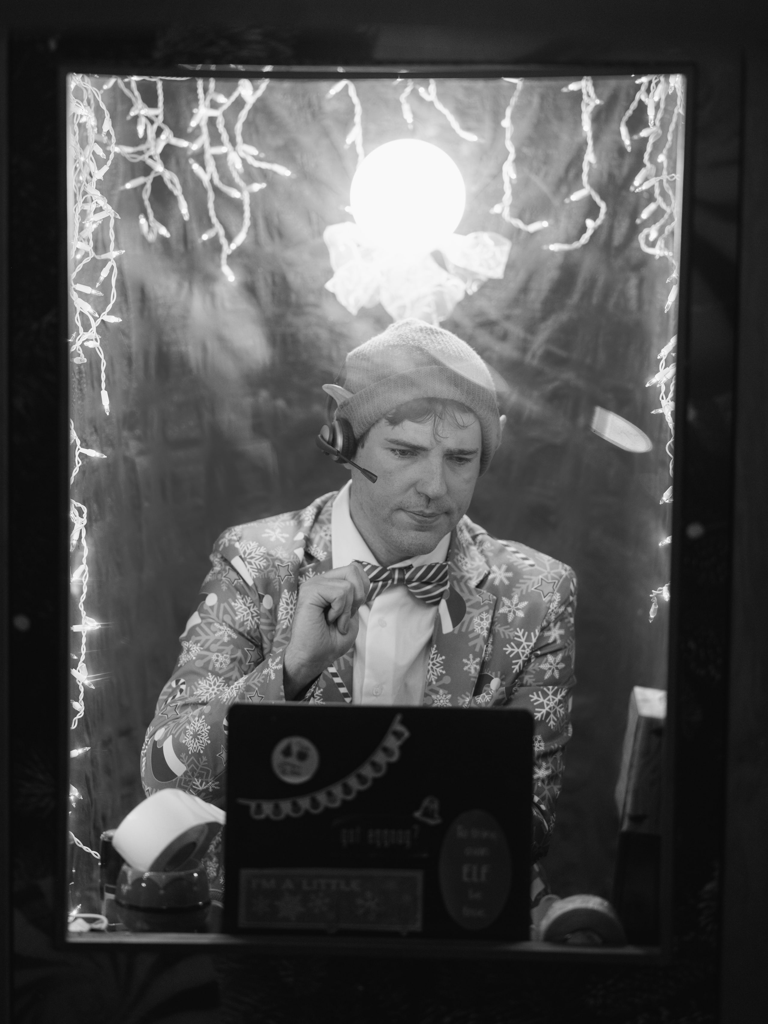 B&w figure with a lamp, all shadow.