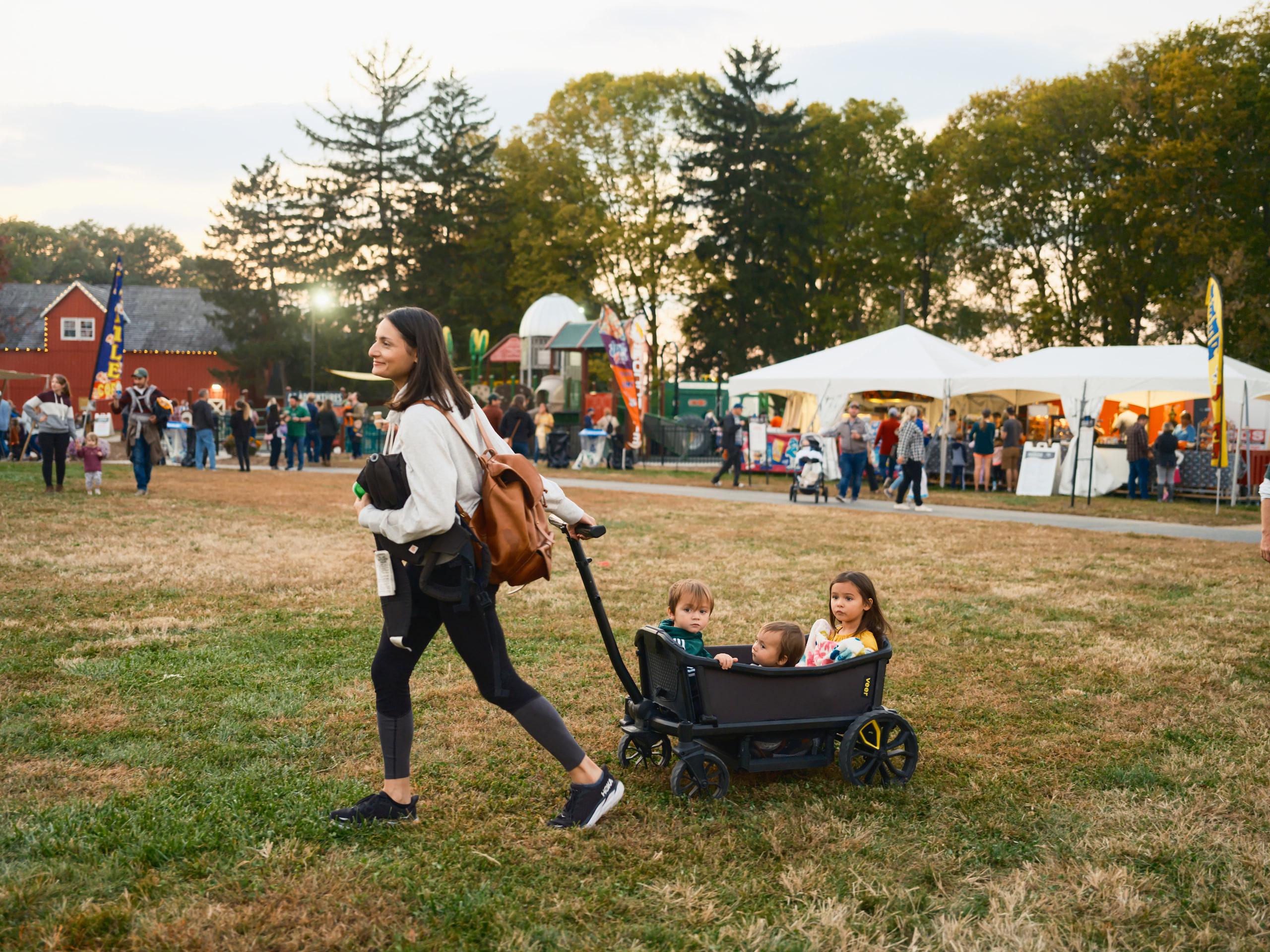 B&w families crossing the field, documentary.