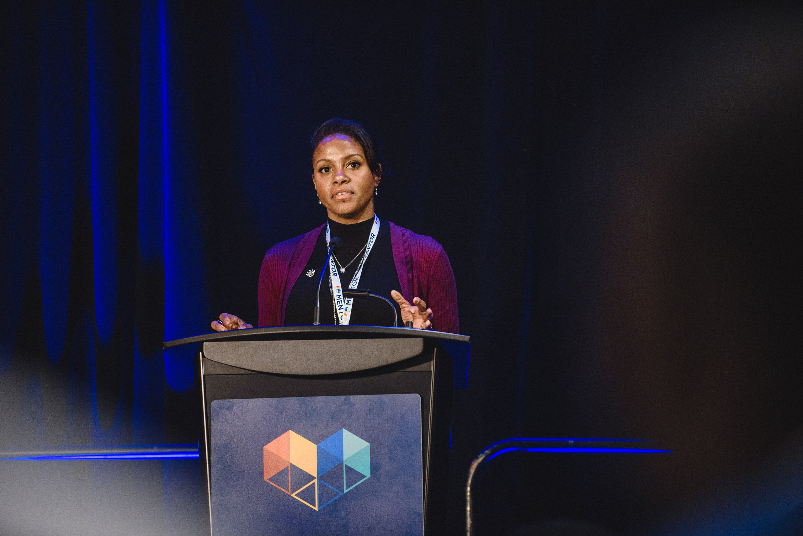 Speaker at the lectern, blue, tall at a conference in Washington, DC.