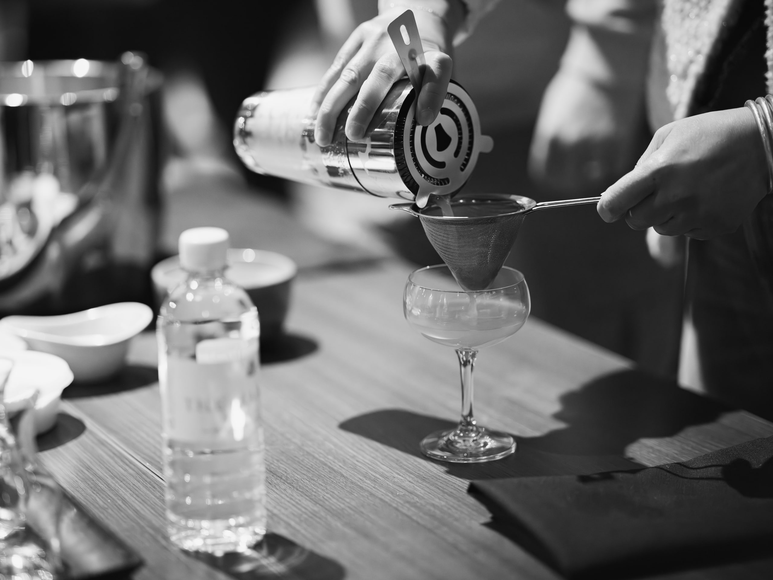 B&w pour into a glass, motion frozen.