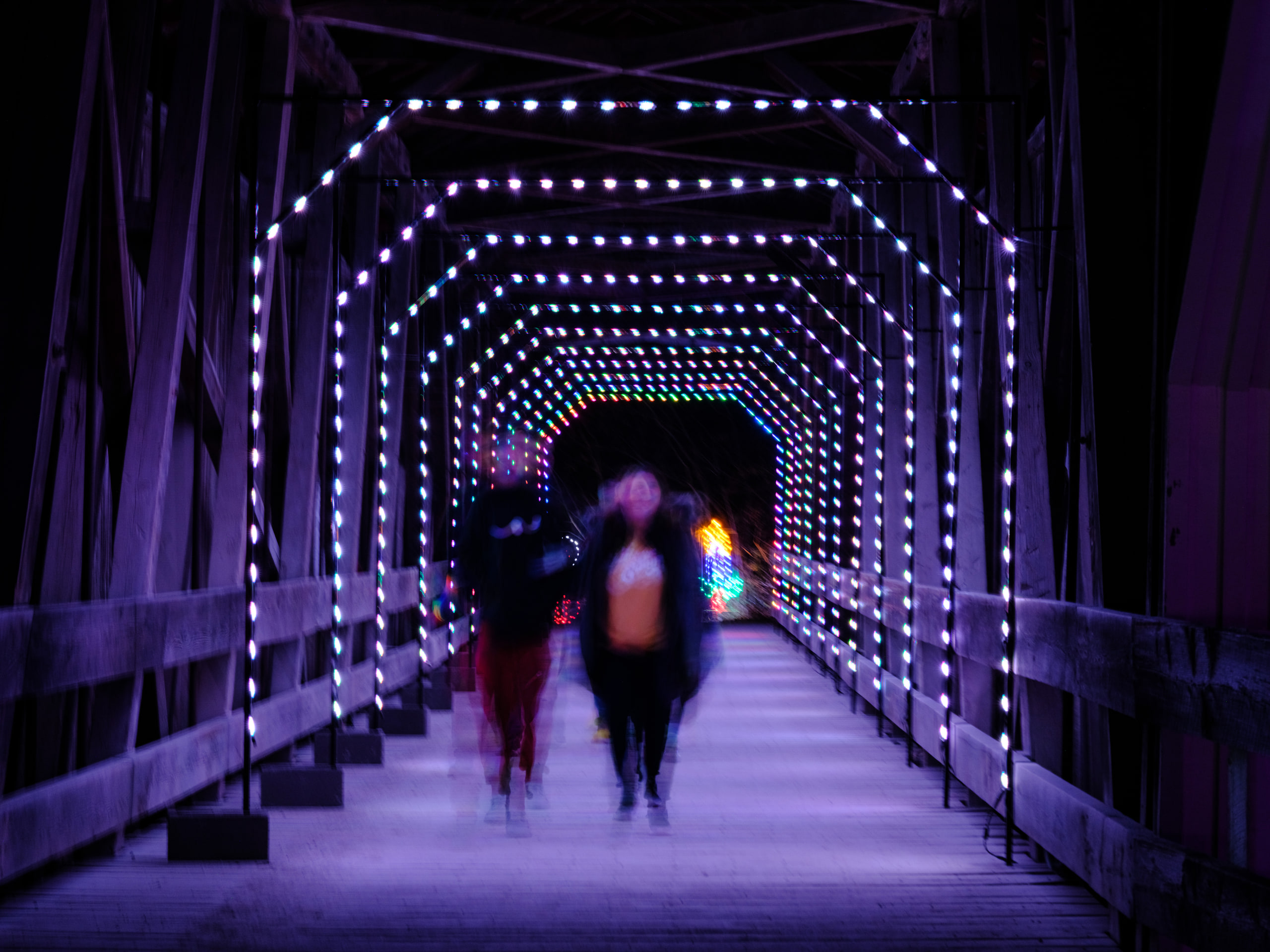 Blue light tunnel, wide at a community event.