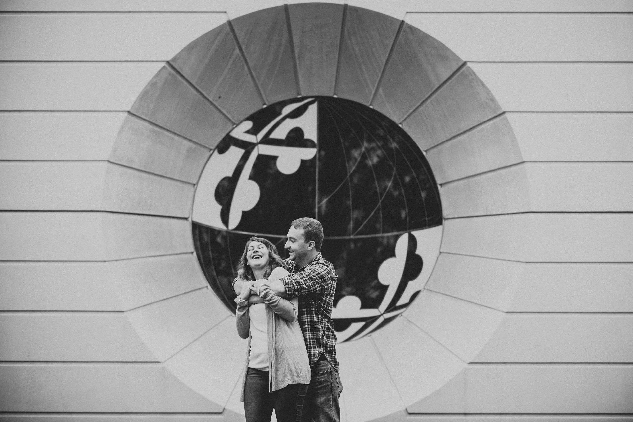 B&w couple in a circular window, reads as art not a wedding.