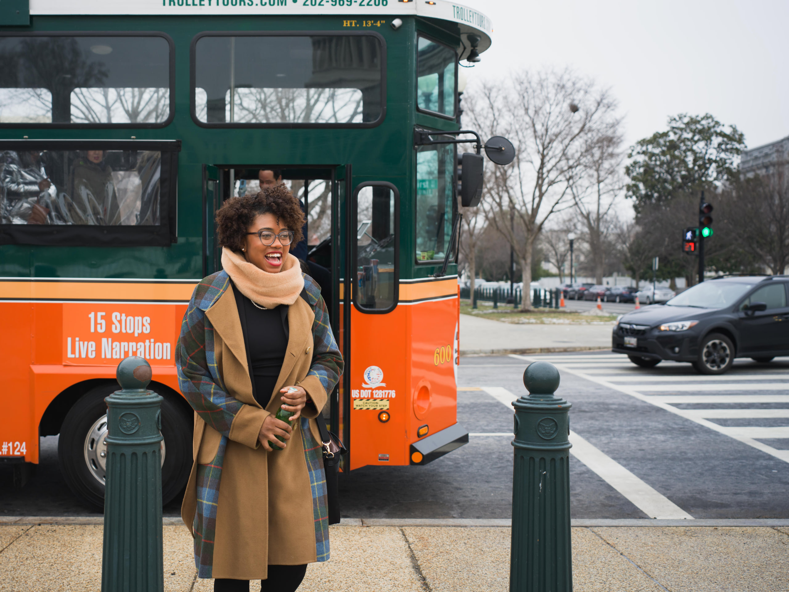 Stepping off the orange trolley, Capitol context at a Capitol Hill day in Washington, DC.