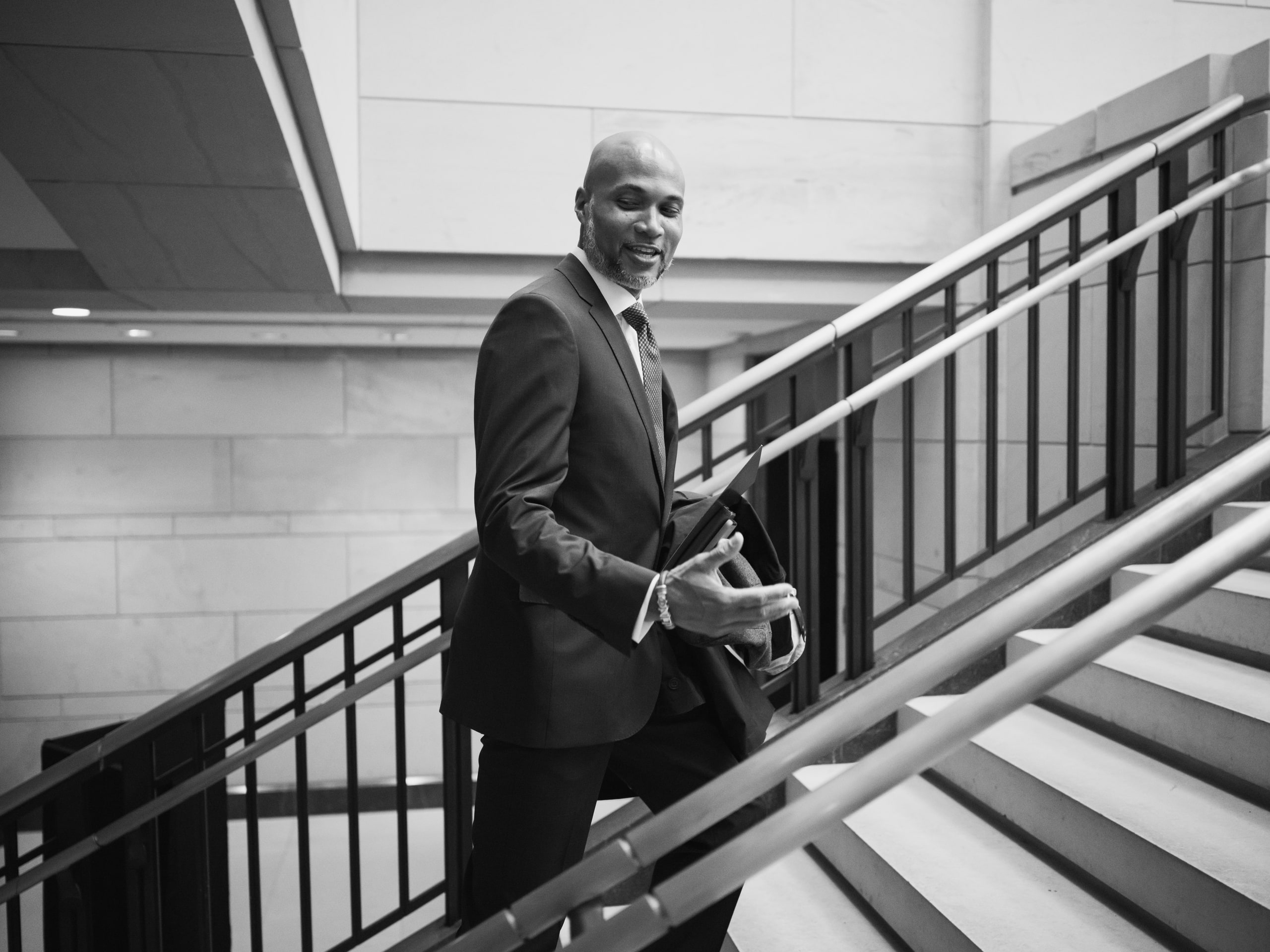Black and white man on the stairs at a Capitol Hill day in Washington, DC.