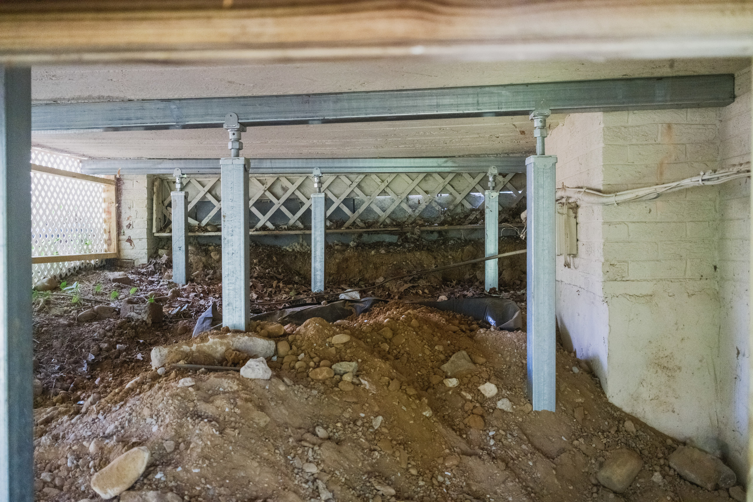 Steel piers under the house, the structure as subject under a house in Alexandria, Virginia.