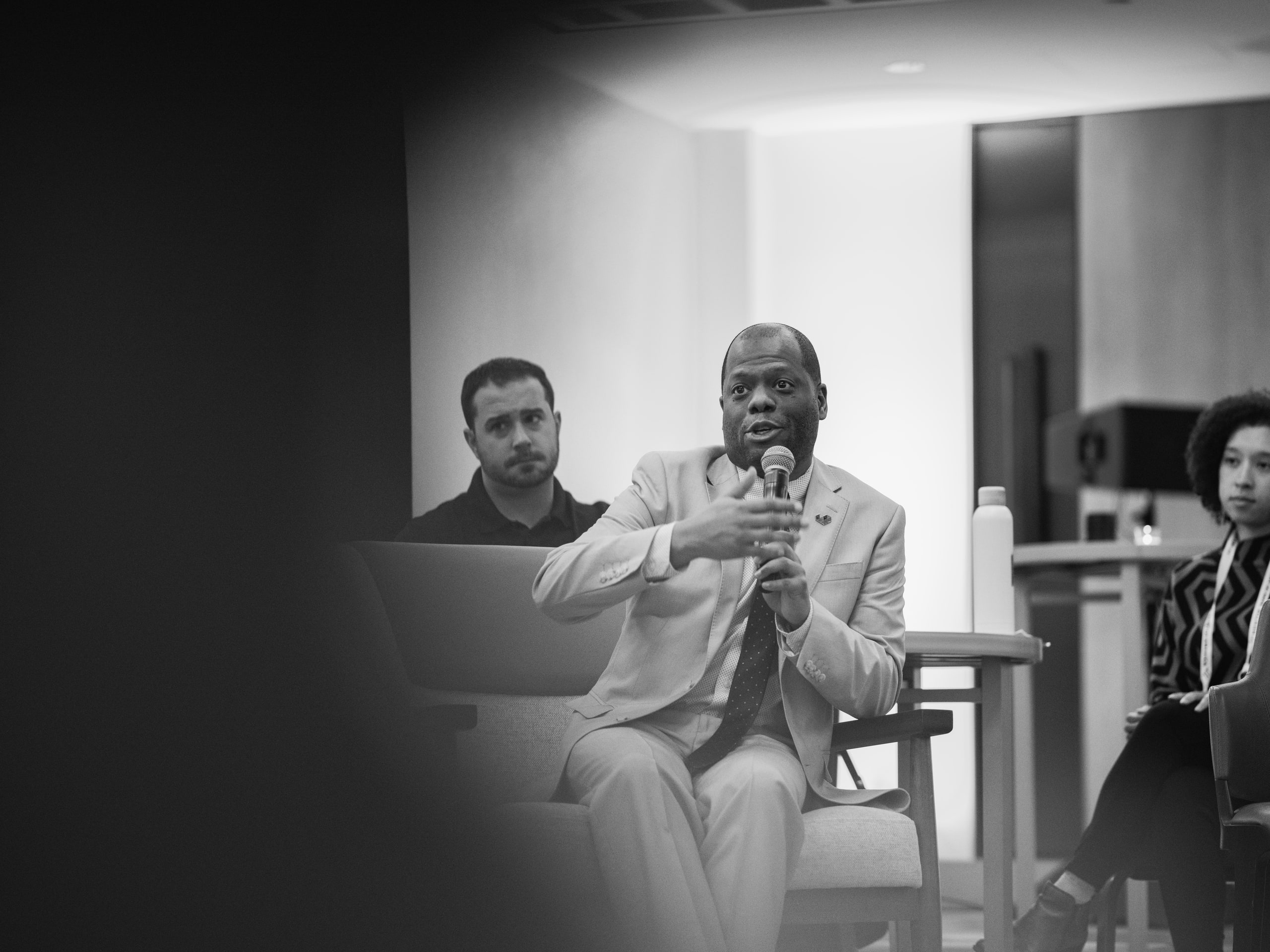 Black and white two panelists at a summit campfire session.